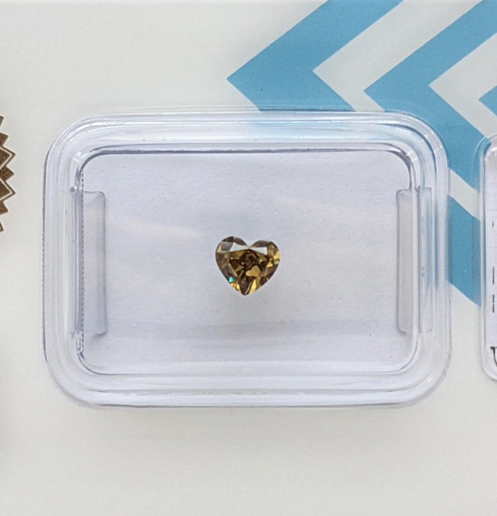0.35ct heart cut natural fancy deep greenish yellow diamond IGI certified VS1 blister pack front – report 720549560