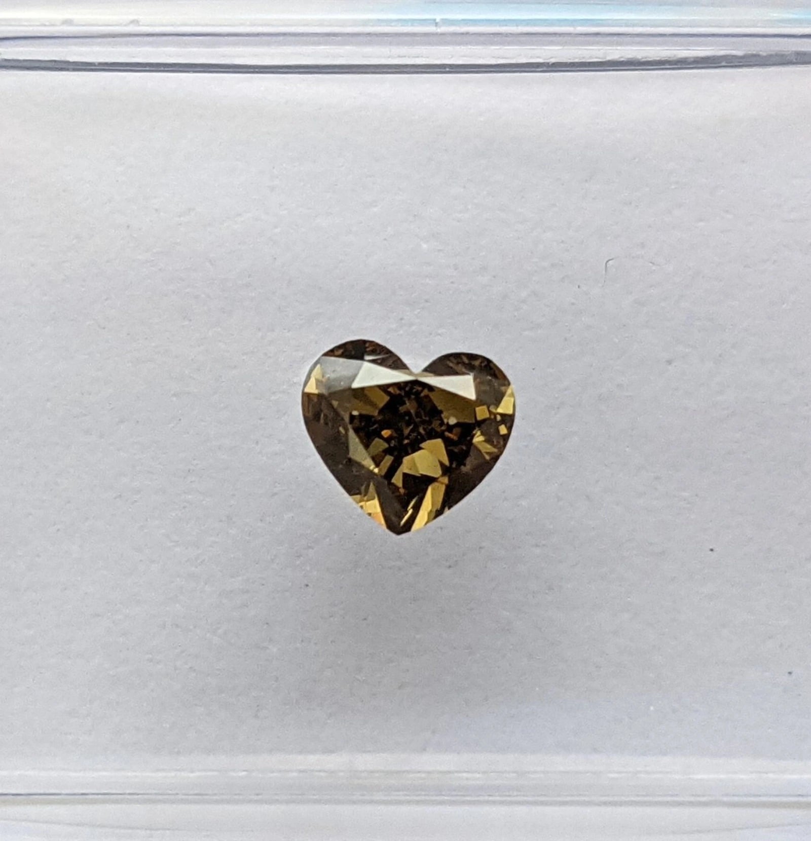 .35ct-natural-fancy-deep-greenish-yellow-heart-diamond-VS1-video-still-IGI-720549560