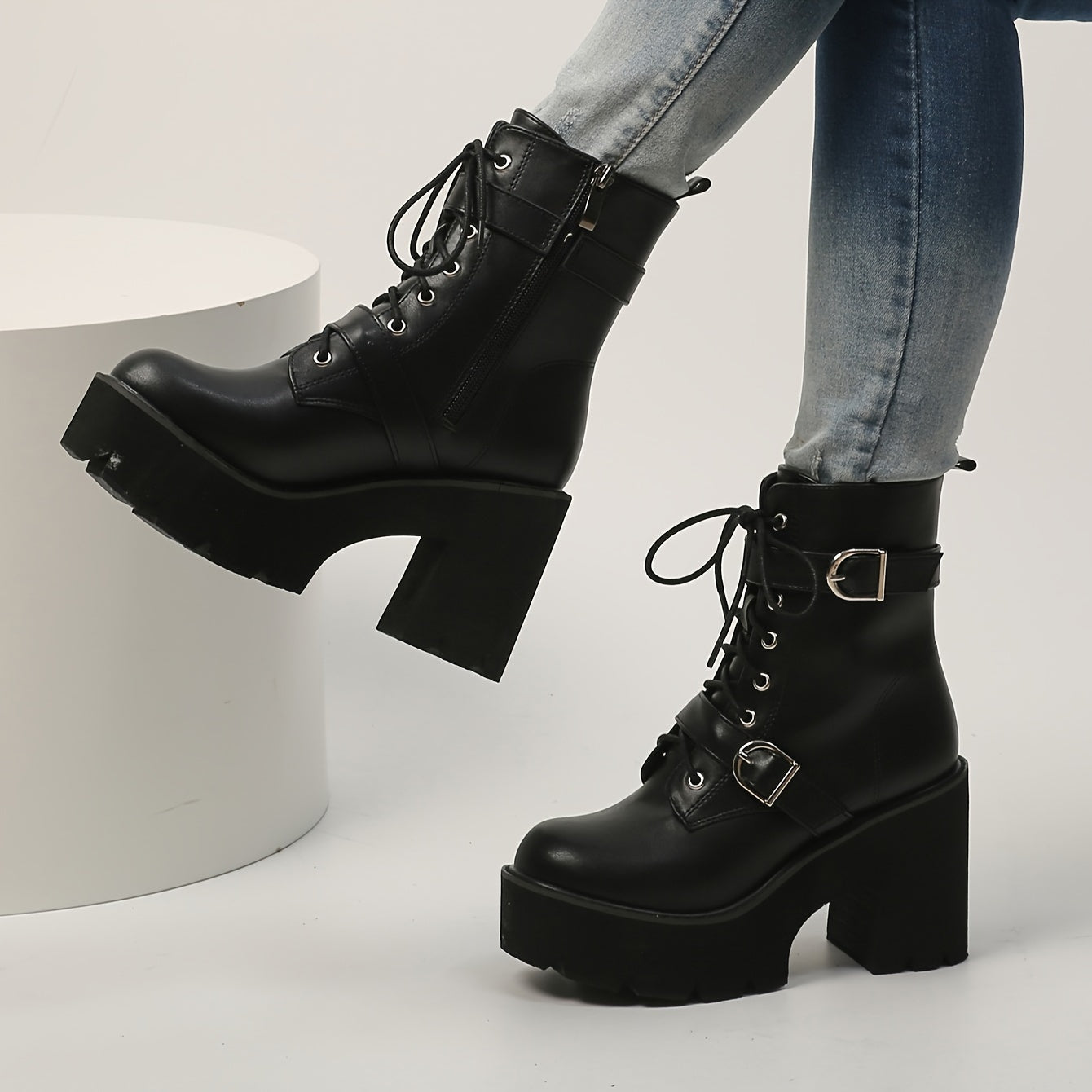 Black ankle boots darkwave fashion women side zipper and chunky block heel close up detail
