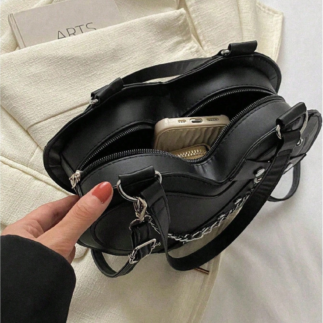 Interior view of gothic heart chain shoulder bag showing zipper closure and compact carry from Alternative Darkwear