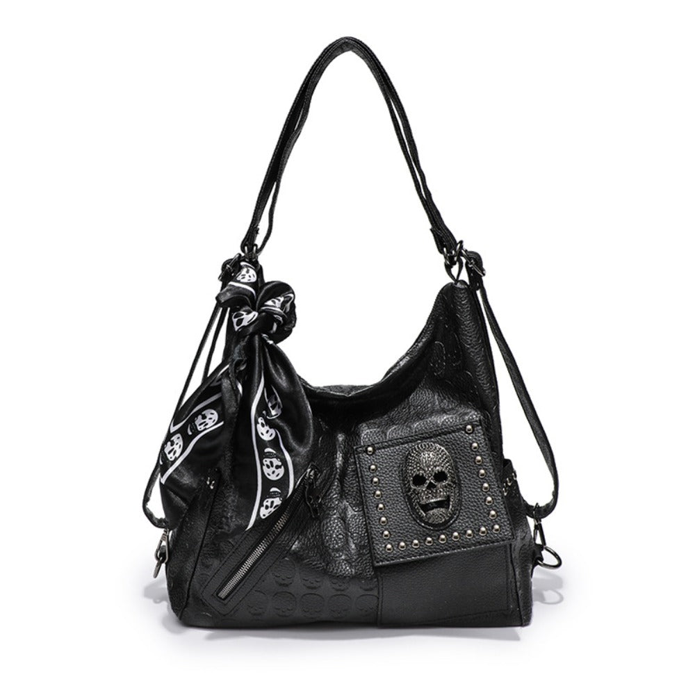 Gothic skull embossed hobo shoulder bag in matte black PU leather with tassel hardware and multi-strap options from Alternative Darkwear
