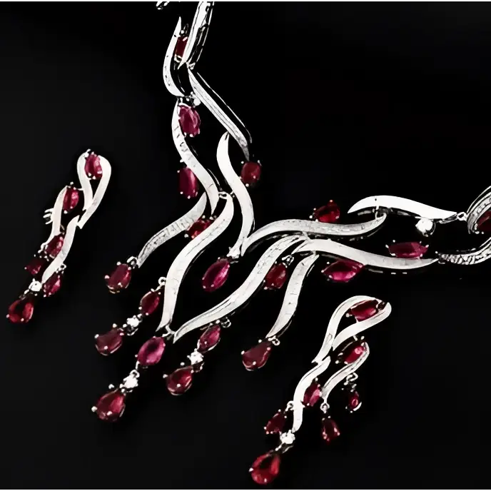 Silver necklace with red gemstones on a black background