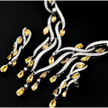 Silver and gold necklace on a black background