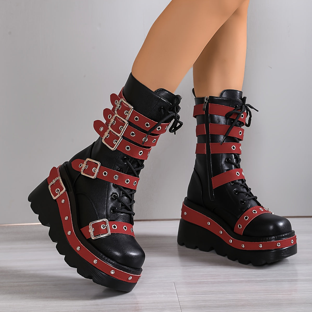 Black mid calf platform boots darkwave fashion women red buckle straps and red stud sole edge front view