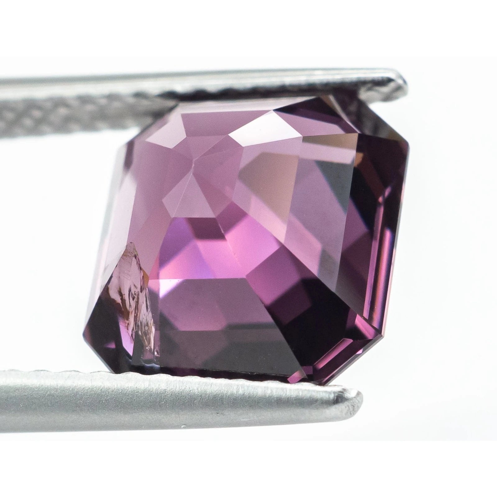 side view of purple unheated  emerald step cut spinel